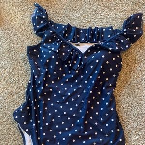 a blue and white polkadot bathing suit